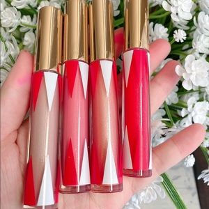 New. A set of 4 lipglosses. Estée Lauder.  Full s